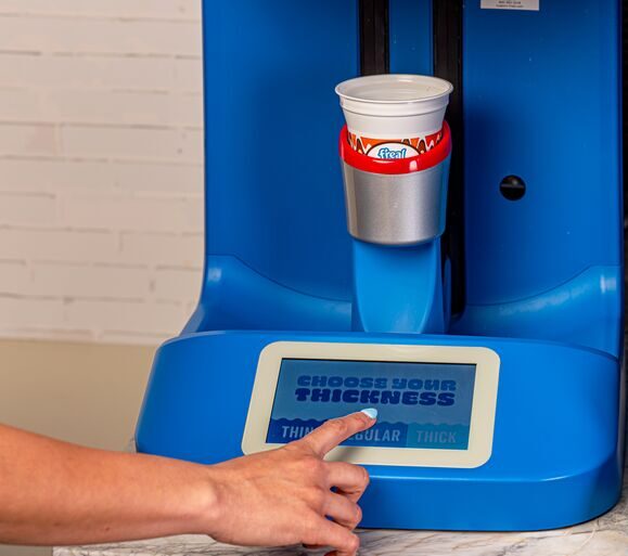 girl making f'real peanut butter milkshake